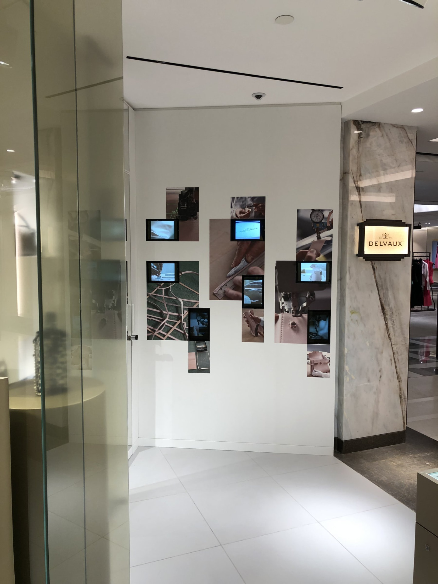 Delvaux — Harrods — Entrance portal with marble pillar and brand signage