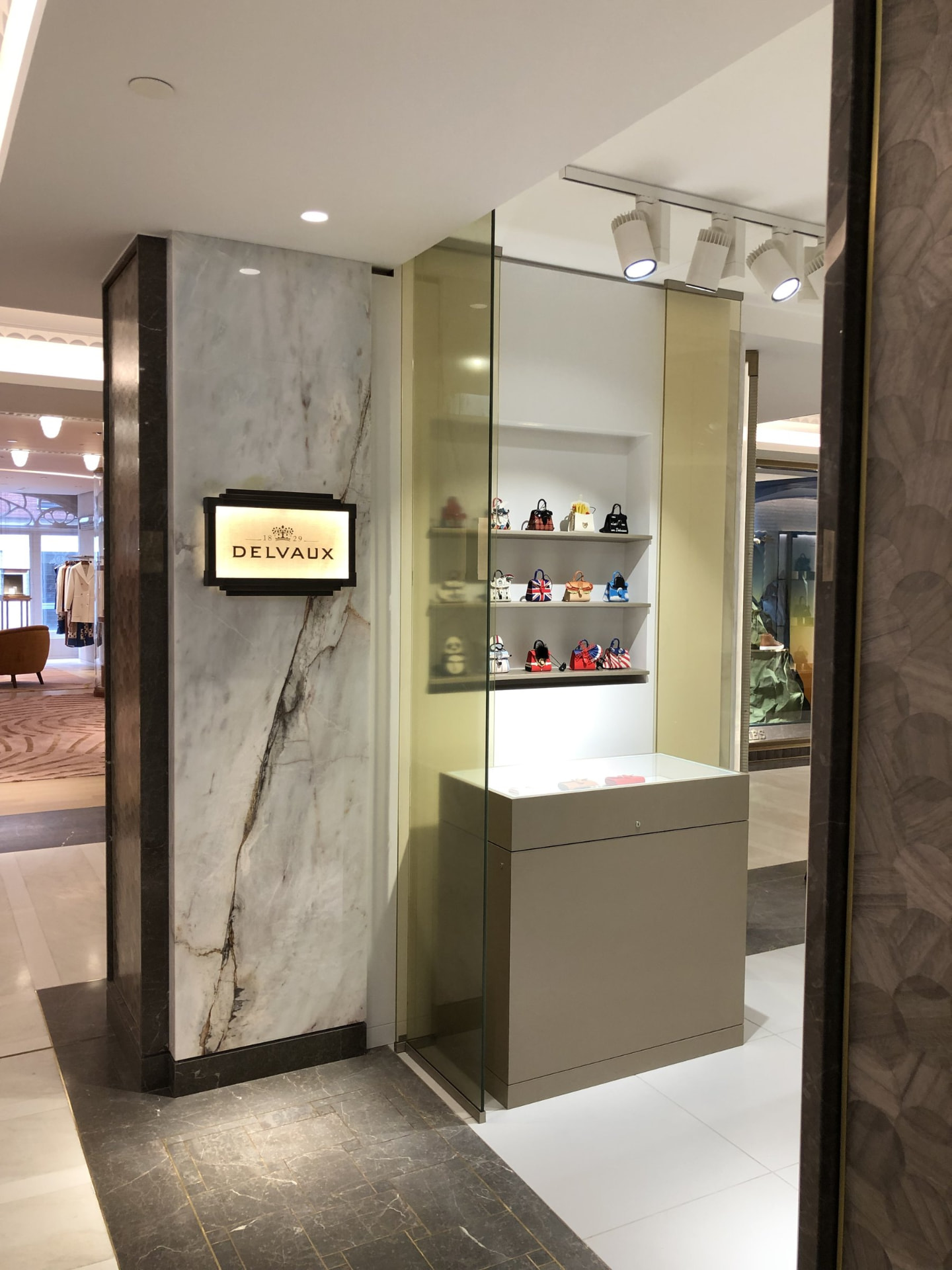 Delvaux — Harrods — Display case beside marble pillar